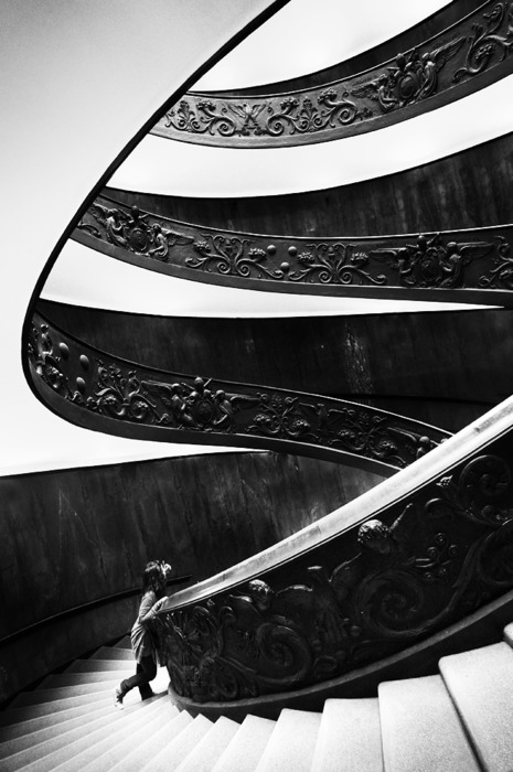 architecture photography of a spiral staircase in black and white